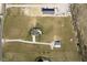 Aerial view of property showing house, outbuilding, driveway, and lawn at 5679 S 675 W, New Palestine, IN 46163