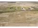 Aerial view highlighting properties set on a large lot, with houses, outbuildings and green grass at 5679 S 675 W, New Palestine, IN 46163