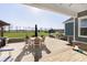 Charming backyard patio with dining set and comfortable seating, offering stunning views of the expansive lawn at 5679 S 675 W, New Palestine, IN 46163