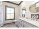 Elegant bathroom with double vanity, stylish mirrors, and modern fixtures at 5679 S 675 W, New Palestine, IN 46163