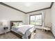 Inviting bedroom featuring a comfortable bed, natural light, and chic decor at 5679 S 675 W, New Palestine, IN 46163