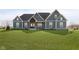Charming home featuring a beautifully designed exterior with a manicured lawn and inviting front porch at 5679 S 675 W, New Palestine, IN 46163
