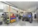 Spacious garage featuring Class A RV, ATV, and ample storage with colorful bins and containers at 5679 S 675 W, New Palestine, IN 46163