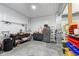 Well-organized garage space with workbench, tool storage, a safe, and organized bins at 5679 S 675 W, New Palestine, IN 46163