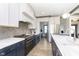 Modern kitchen with stainless steel appliances, custom cabinets, and spacious countertop at 5679 S 675 W, New Palestine, IN 46163