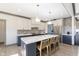Stylish kitchen island with white marble countertop, pendant lights, and seating for three at 5679 S 675 W, New Palestine, IN 46163