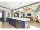 Spacious kitchen with large island, stainless steel appliances, and open layout to the living area at 5679 S 675 W, New Palestine, IN 46163