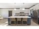 Gorgeous kitchen island with seating, stylish pendant lighting, and stainless steel appliances at 5679 S 675 W, New Palestine, IN 46163
