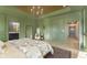 Luxurious main bedroom with a full-length mirror and adjoining bath at 5679 S 675 W, New Palestine, IN 46163