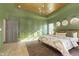 The main bedroom features a patterned area rug and a ceiling with an elegant chandelier at 5679 S 675 W, New Palestine, IN 46163