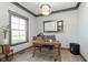 Bright home office featuring a large window with natural light and a classic wooden desk at 5679 S 675 W, New Palestine, IN 46163