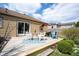 Backyard deck with comfortable seating, a table, and an outdoor swing at 5735 Brouse Ave, Indianapolis, IN 46220