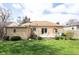 Well maintained backyard with a small deck, patio seating, and a well-kept lawn at 5735 Brouse Ave, Indianapolis, IN 46220