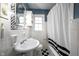 Classic bathroom with black and white tiling and vintage style fixtures at 5735 Brouse Ave, Indianapolis, IN 46220