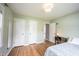 Light-filled bedroom with hardwood floors and ample closet space for storage at 5735 Brouse Ave, Indianapolis, IN 46220