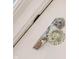 Close-up of a classic glass doorknob on a white door frame at 5735 Brouse Ave, Indianapolis, IN 46220