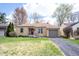 Charming one-story home with a well-manicured lawn, driveway, and attached garage at 5735 Brouse Ave, Indianapolis, IN 46220