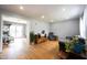 Comfortable living room with hardwood floors, neutral walls, ample natural light, and an open doorway at 5735 Brouse Ave, Indianapolis, IN 46220