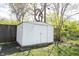 White storage shed in a grassy backyard, offering ample space for gardening tools and equipment at 5735 Brouse Ave, Indianapolis, IN 46220