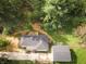 An overhead aerial view showcases the home with a new roof, detached garage, and surrounded by lush greenery at 5820 Bonnie Brae St, Indianapolis, IN 46228