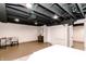 Spacious finished basement with painted ceiling, luxury vinyl floors, and stylish decor at 5820 Bonnie Brae St, Indianapolis, IN 46228