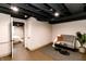 Cozy finished basement featuring a sitting area and ample space for relaxation at 5820 Bonnie Brae St, Indianapolis, IN 46228
