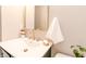 Elegant bathroom featuring a modern sink, gold fixtures, and stylish mirror at 5820 Bonnie Brae St, Indianapolis, IN 46228
