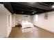 Finished basement bedroom with painted ceiling, neutral walls, and luxury vinyl floors at 5820 Bonnie Brae St, Indianapolis, IN 46228