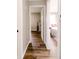 Inviting hallway with wood floors, connecting bedrooms, and creating a seamless flow at 5820 Bonnie Brae St, Indianapolis, IN 46228