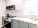 Kitchen featuring stainless steel appliances, white subway tile and two-tone cabinets at 5820 Bonnie Brae St, Indianapolis, IN 46228