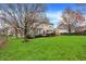Expansive backyard with lush green grass and a patio area, ideal for relaxation and gatherings at 6037 Porter Ln, Noblesville, IN 46062