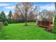 A well-kept backyard with a deck, offering a private outdoor space for leisure and enjoyment at 6037 Porter Ln, Noblesville, IN 46062