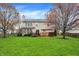 A spacious backyard featuring a well-maintained lawn and a wooden deck, perfect for outdoor entertainment at 6037 Porter Ln, Noblesville, IN 46062