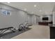 Versatile basement area featuring a stationary bicycle and fitness equipment, ideal for a home gym at 6037 Porter Ln, Noblesville, IN 46062