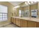 Neutral bathroom featuring a double sink vanity, large mirror, and glass enclosed shower at 6037 Porter Ln, Noblesville, IN 46062