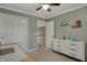Cozy bedroom featuring a ceiling fan, modern dresser, and neutral tones for a comfortable retreat at 6037 Porter Ln, Noblesville, IN 46062