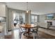 Cozy dining area adjacent to the kitchen, featuring a round table and access to the living room at 6037 Porter Ln, Noblesville, IN 46062