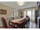 Elegant dining room with hardwood floors, large table, and chairs near a bright window at 6037 Porter Ln, Noblesville, IN 46062