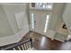 Bright two-story foyer with hardwood floors and modern staircase at 6037 Porter Ln, Noblesville, IN 46062
