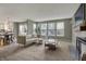 Bright living room with large windows, fireplace, and an open floor plan at 6037 Porter Ln, Noblesville, IN 46062