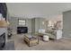 Cozy living room with a fireplace, piano, and stylish coffee table at 6037 Porter Ln, Noblesville, IN 46062
