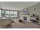 The home has a light-filled living room, with a fireplace and backyard views at 6037 Porter Ln, Noblesville, IN 46062