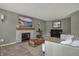 This living room features a fireplace, grand piano, and a large picture window at 6037 Porter Ln, Noblesville, IN 46062