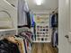 Spacious walk-in closet with shelving for shoes and handbags and hanging space for clothes at 6037 Porter Ln, Noblesville, IN 46062