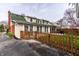 Charming backyard boasts a well-maintained lawn, wood fence, patio, and mature trees at 6041 Garver Rd, Indianapolis, IN 46208