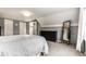 Spacious bedroom with neutral tones, carpet, a large closet, and lots of natural light at 6041 Garver Rd, Indianapolis, IN 46208