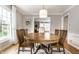 Inviting dining room with hardwood floors, a round wood table, and a view to other rooms at 6041 Garver Rd, Indianapolis, IN 46208