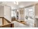 Light-filled hallway with access to a full bathroom and a cozy sitting room at 6041 Garver Rd, Indianapolis, IN 46208