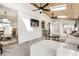 Bright living room with wood ceiling, plenty of natural light, and seamless flow into the dining room at 6041 Garver Rd, Indianapolis, IN 46208