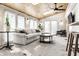 Open-concept sunroom with ample natural light and ceiling fans at 6041 Garver Rd, Indianapolis, IN 46208
